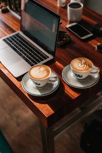 two-coffees-cappuccino-laptop