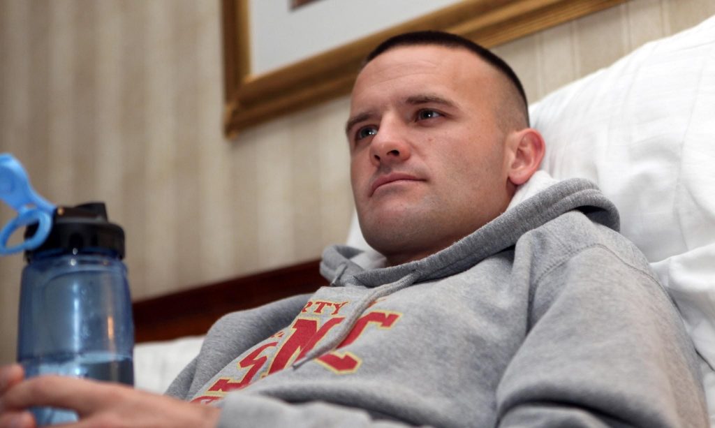 man-sitting-on-bed