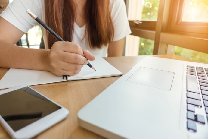 woman-writing-laptop-homework