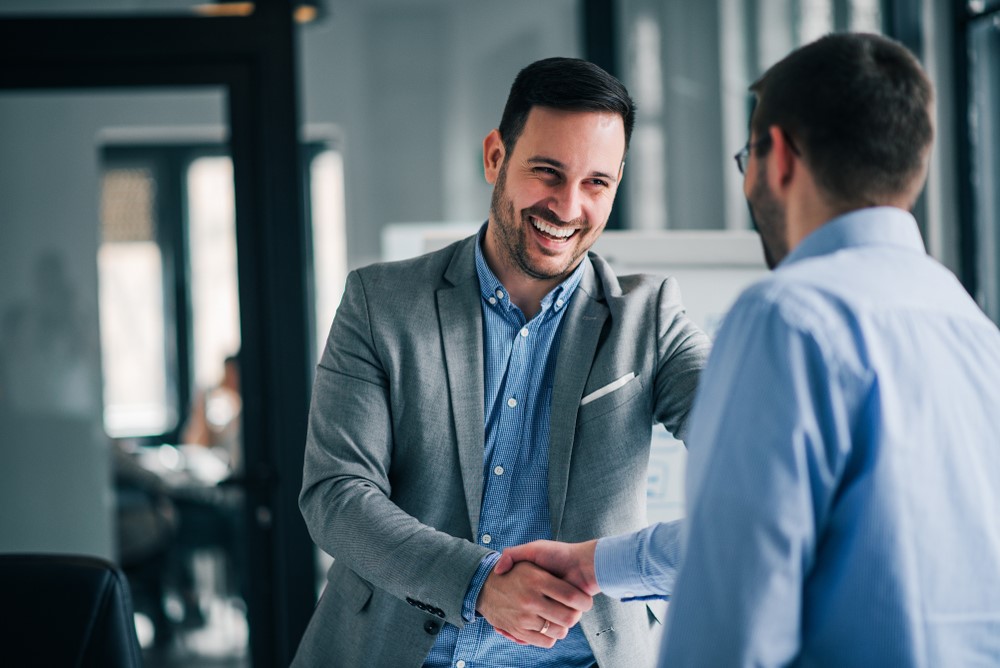 two men shaking hands-agreement-happy-smiles