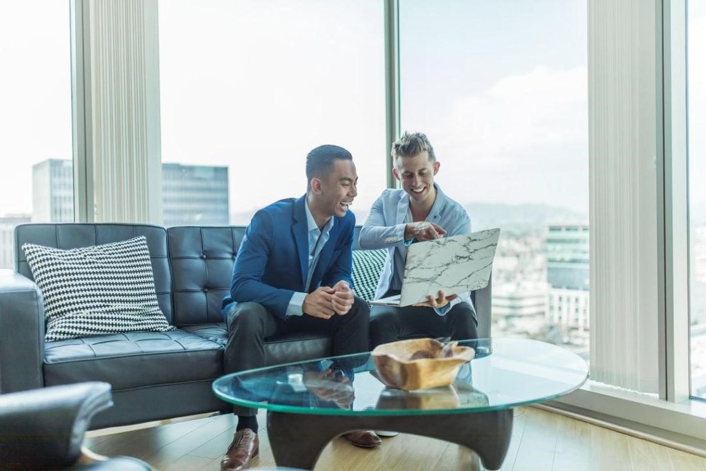 business men-laptop-guys-working-laughing-agreeing-meeting