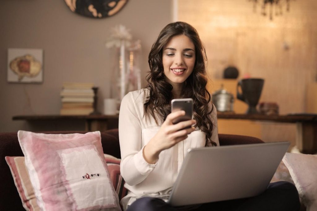 work from home-woman with cellphone-social media-entrepreneur