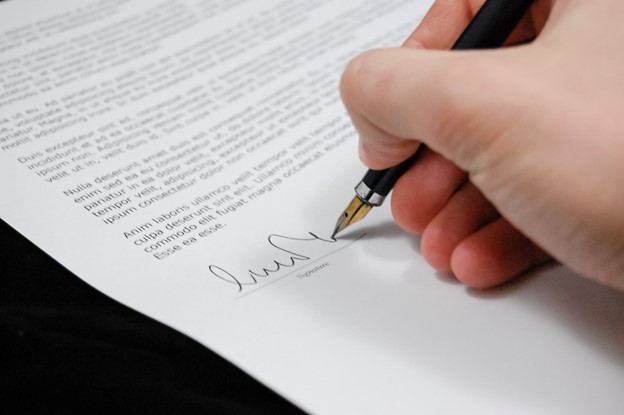 contract-man holding a pen