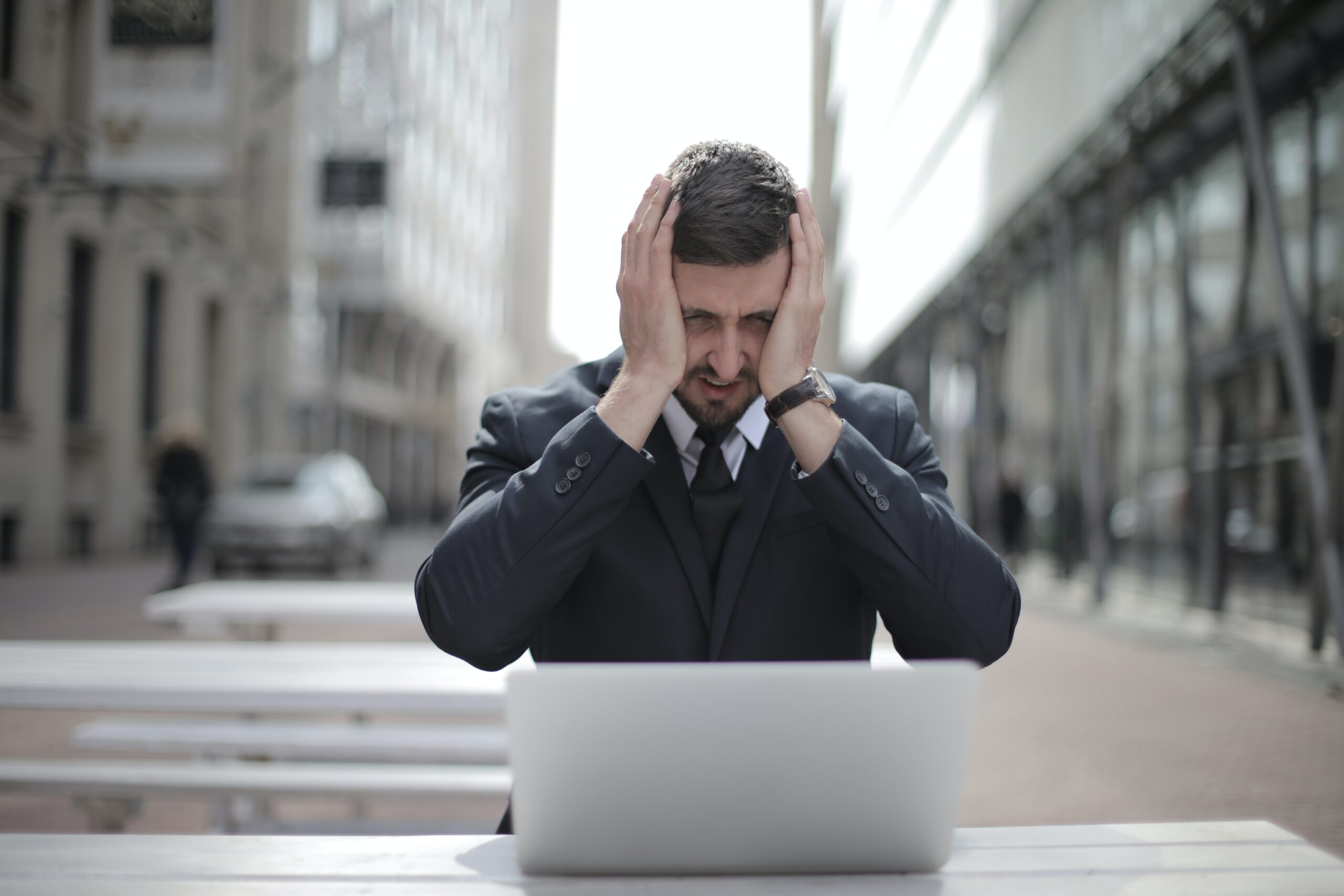 man holding head-stress