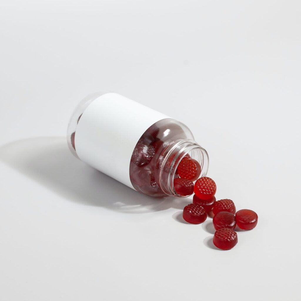 spilled supplement gummies on a white surface