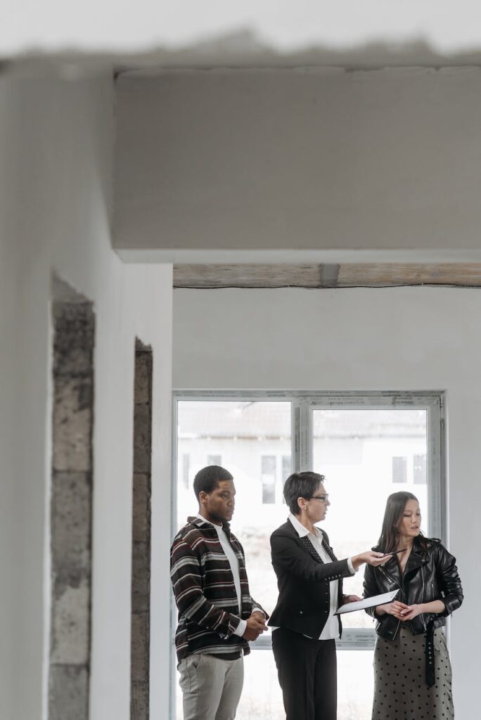 real estate agent talking to clients