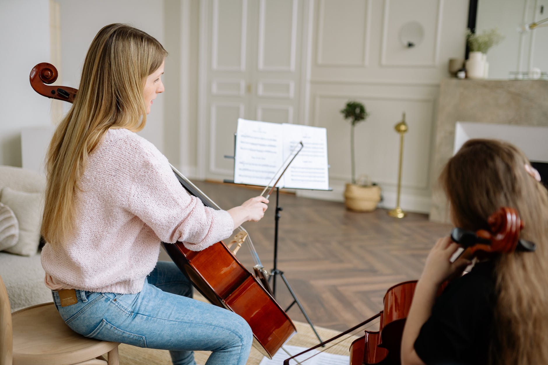 woman and child playing musical instruments