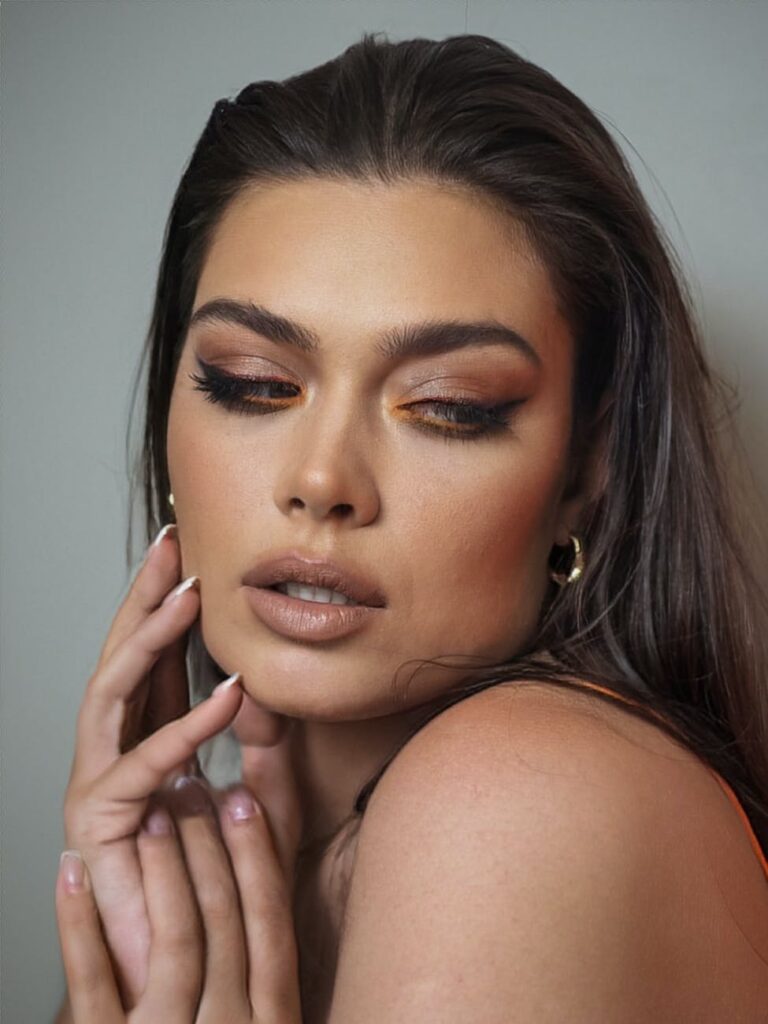 portrait of woman with golden makeup