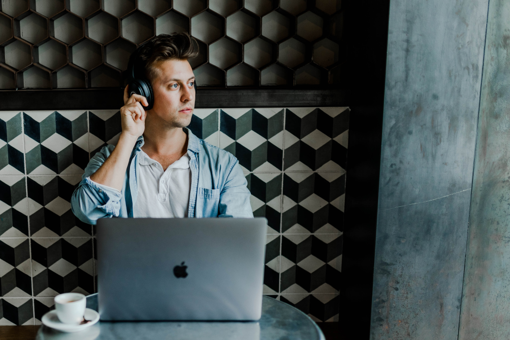 man listening to headphone