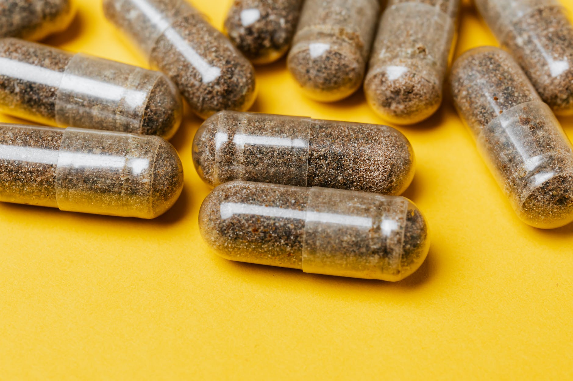 capsules on yellow surface