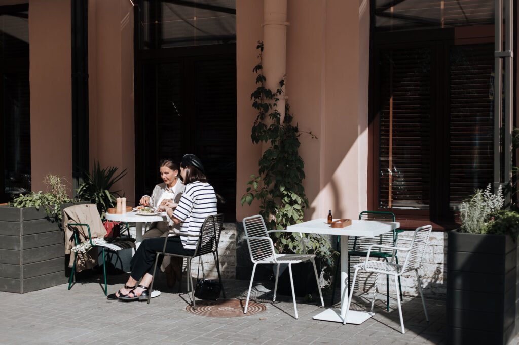 women eating outside the restaurant