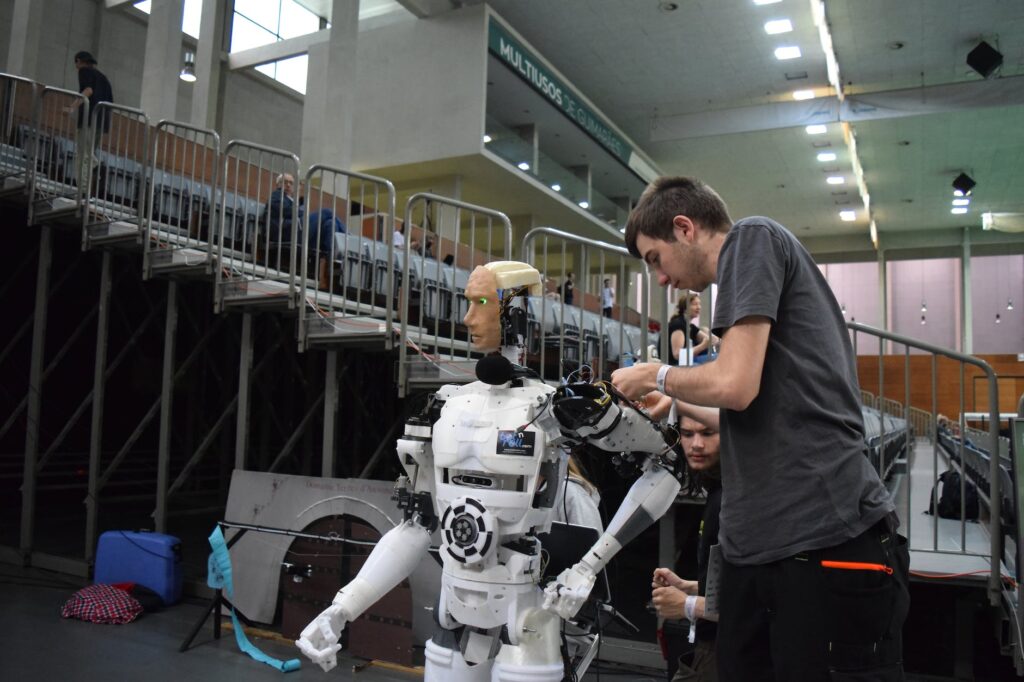 men fixing the robot