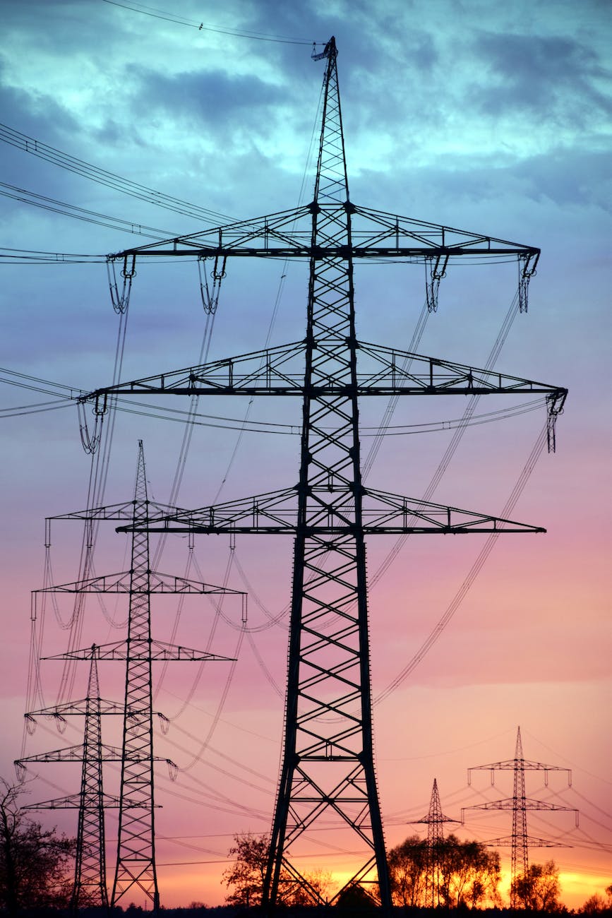 black electric tower under blue sky