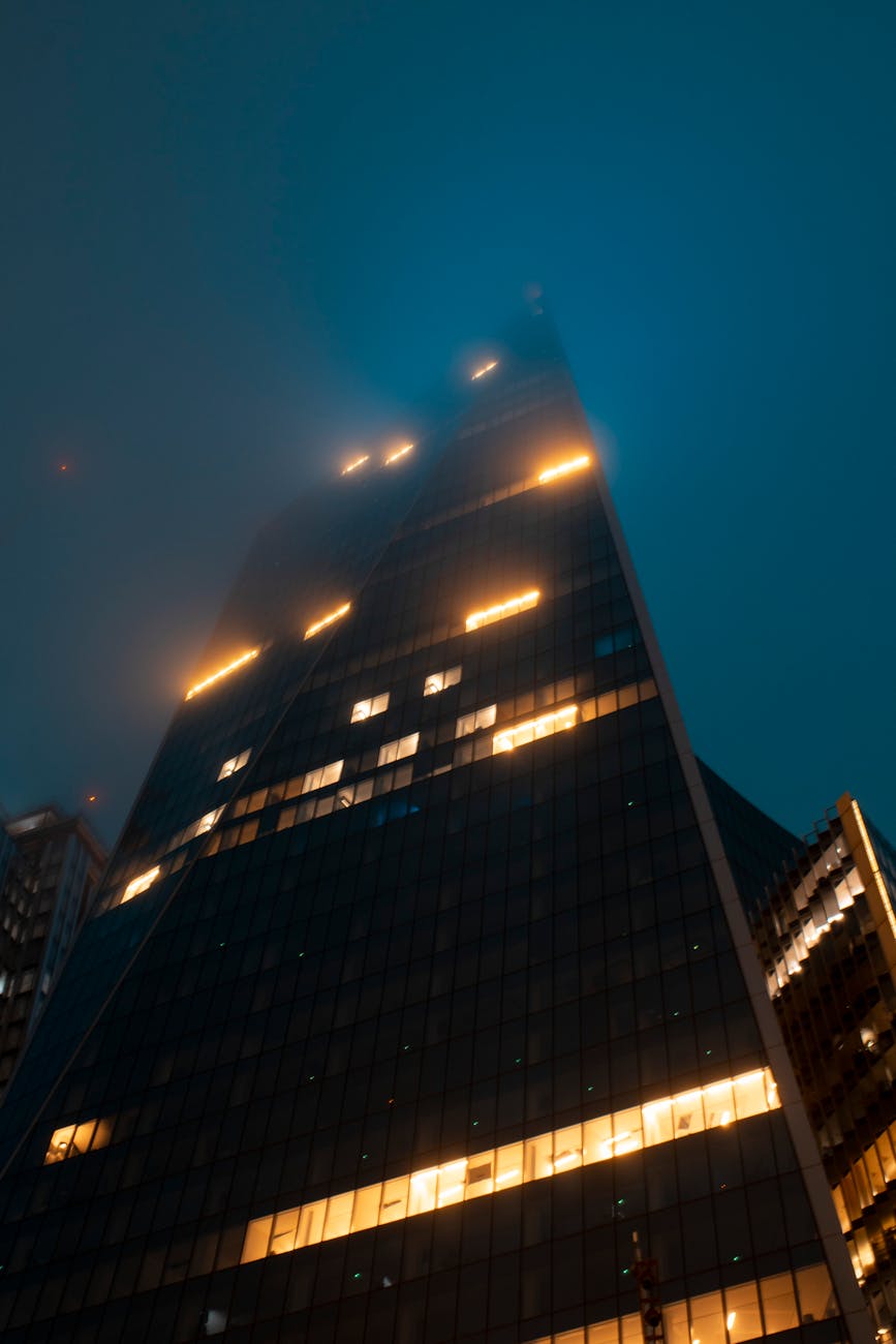 fog over skyscraper in evening