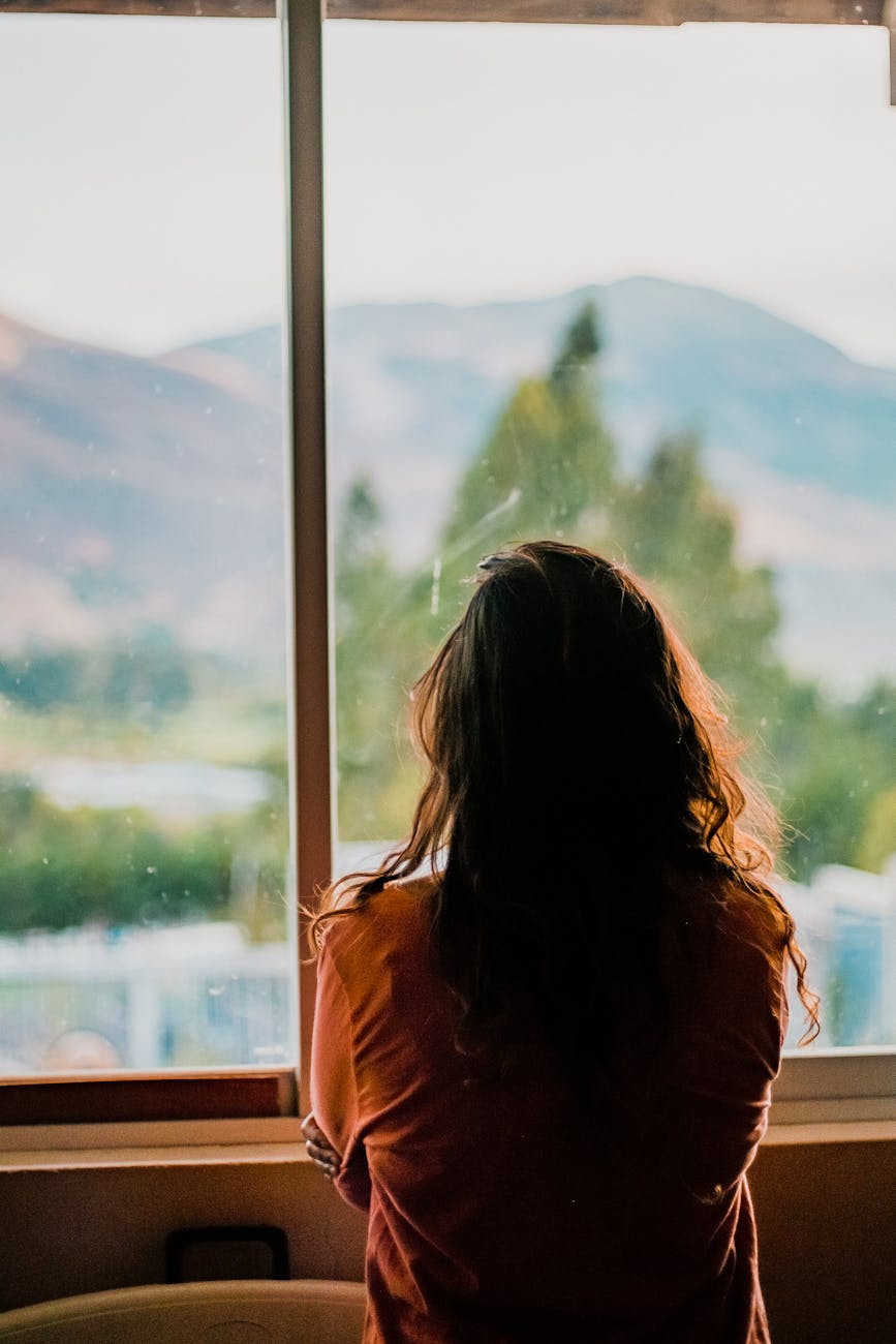 woman wearing brown shirt inside room