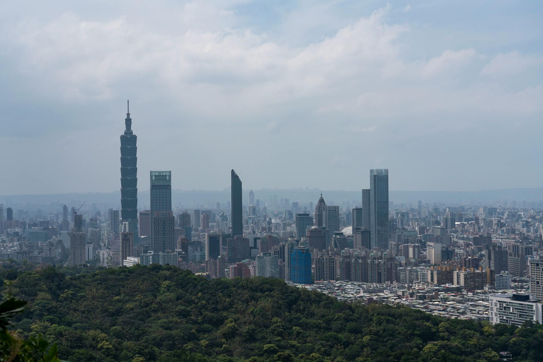 skyscrapers in taipei covered with fog