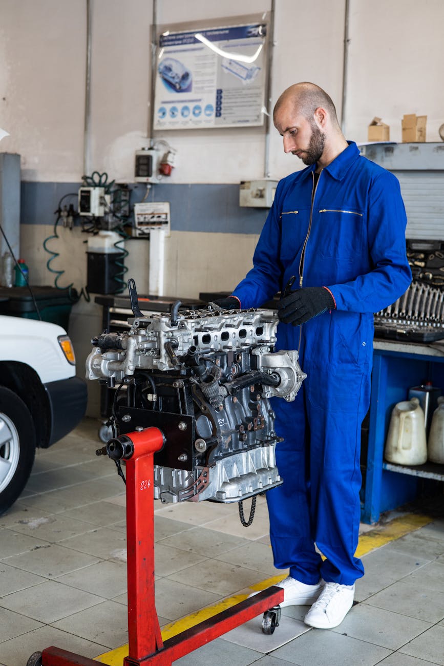 a mechanic checking a car s engine