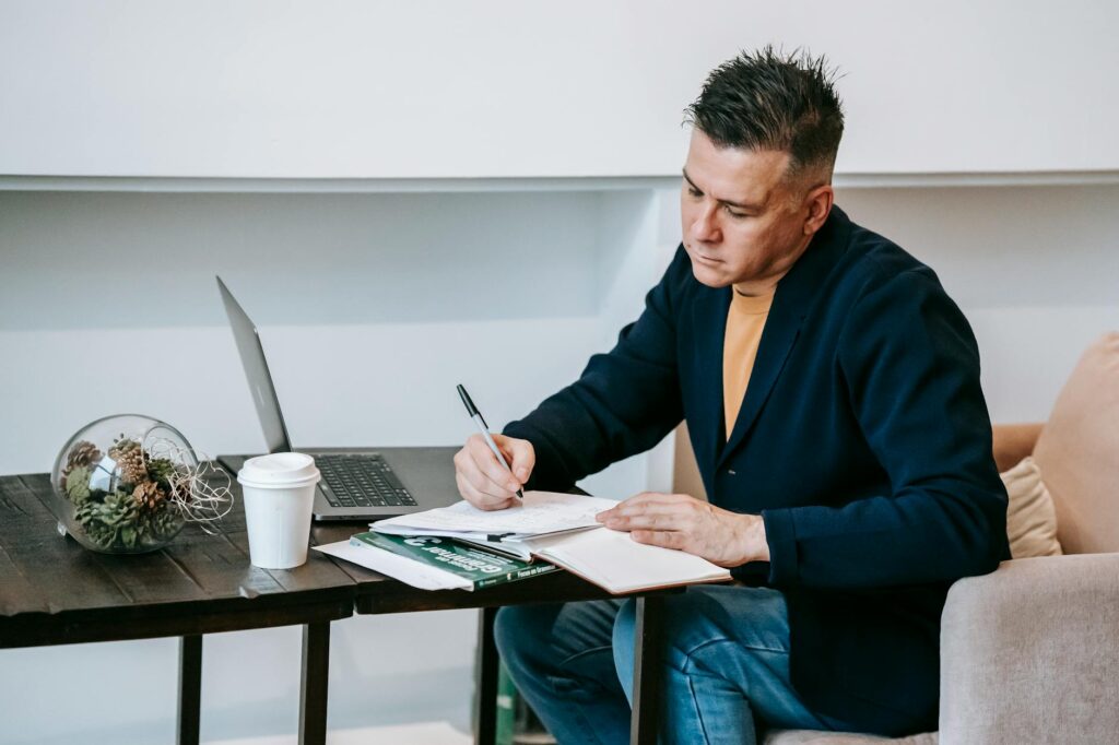 photo of man doing paper work