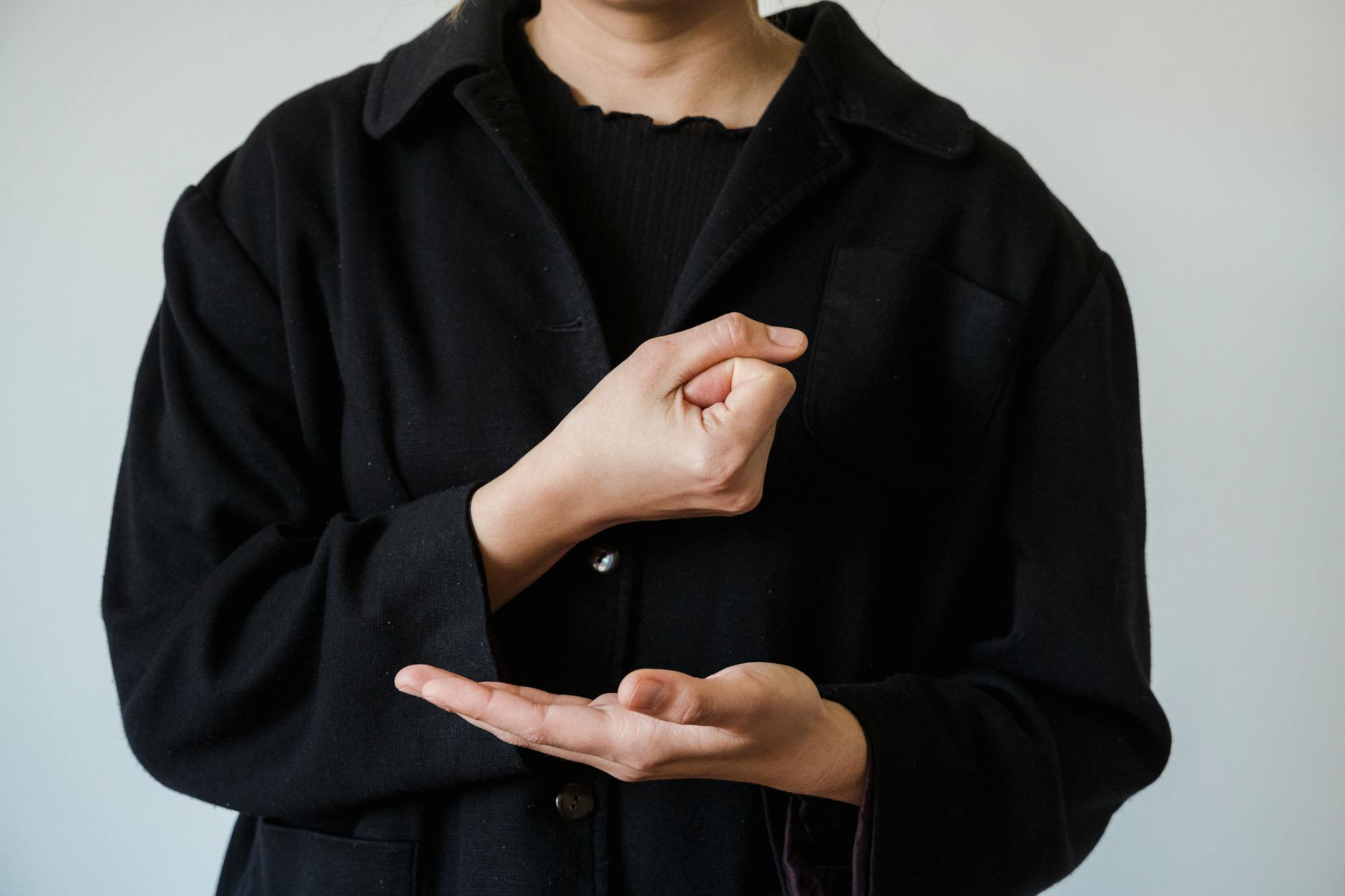 a person doing american sign language