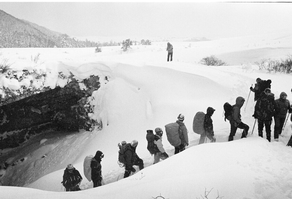 mountain climbing in snowstorm