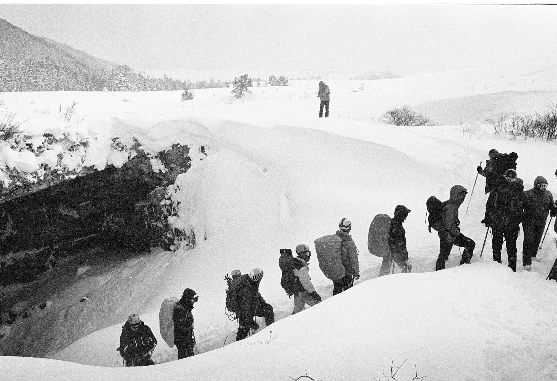 mountain climbing in snowstorm