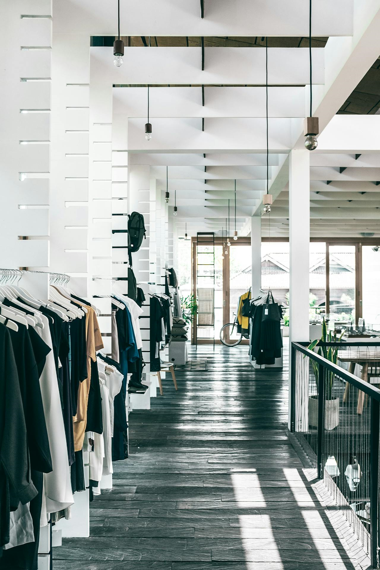 Fashion store interior with garments hanging on racks