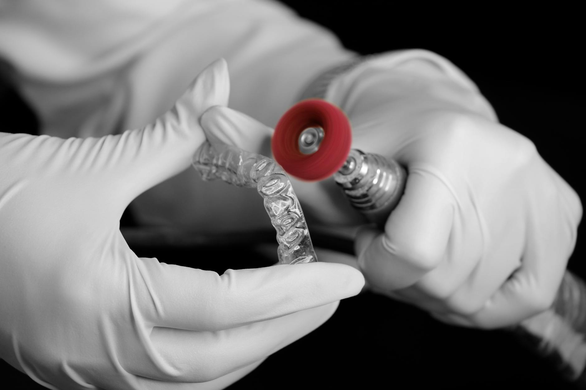 close up of a dental technician making an invisalign