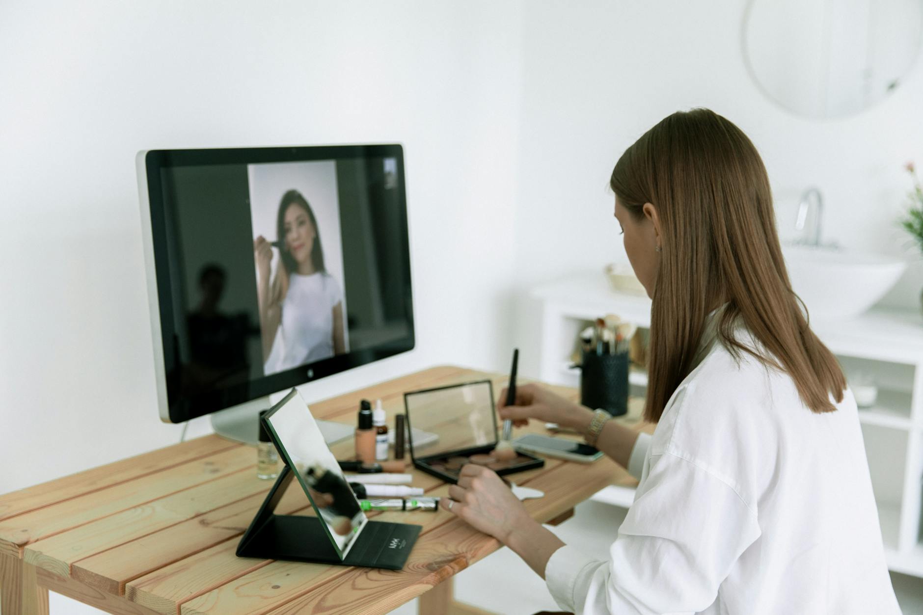 photo of woman sitting in front of computer