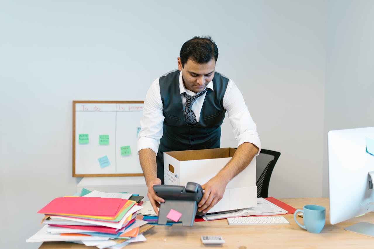 Man packing up his desk