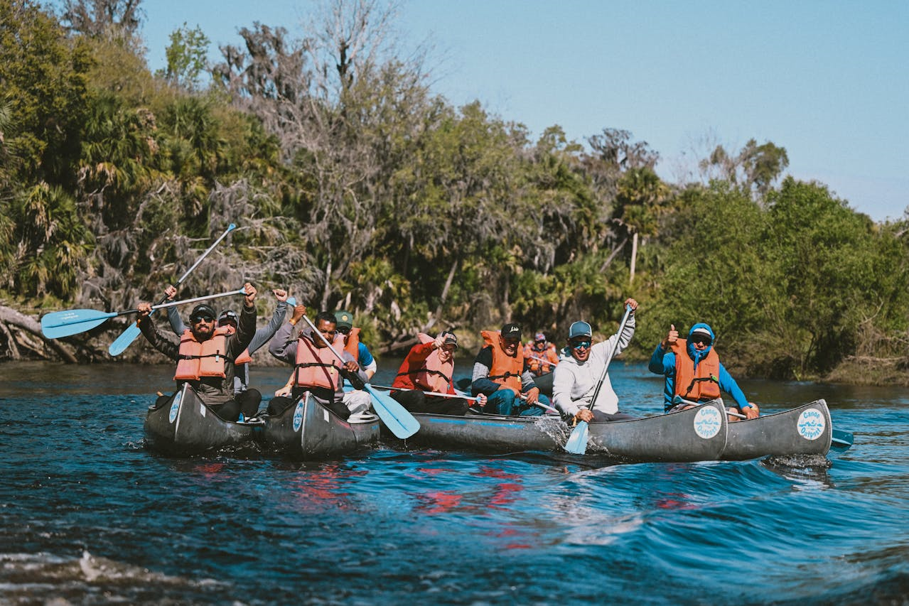 People Canoeing on River