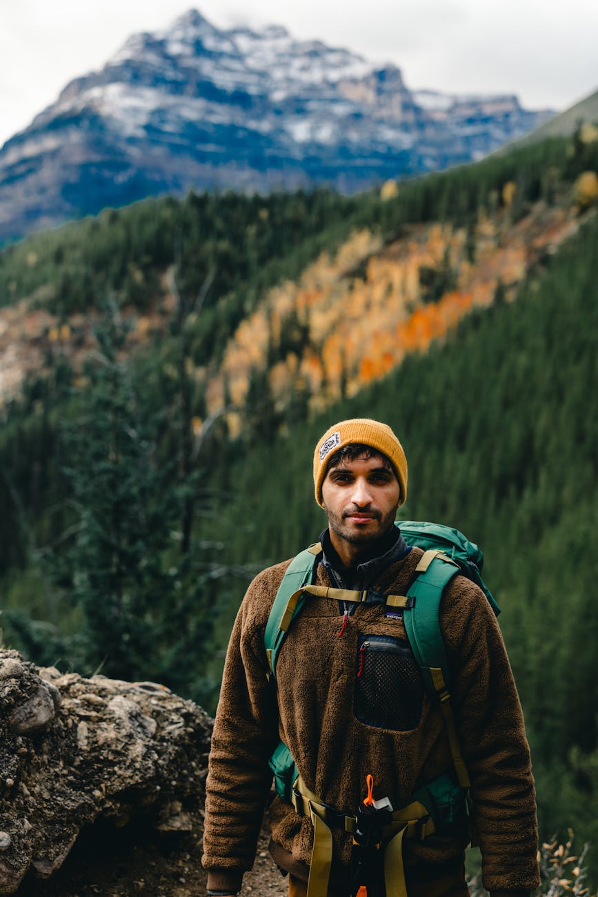 young man hiking in scenic mountain landscape