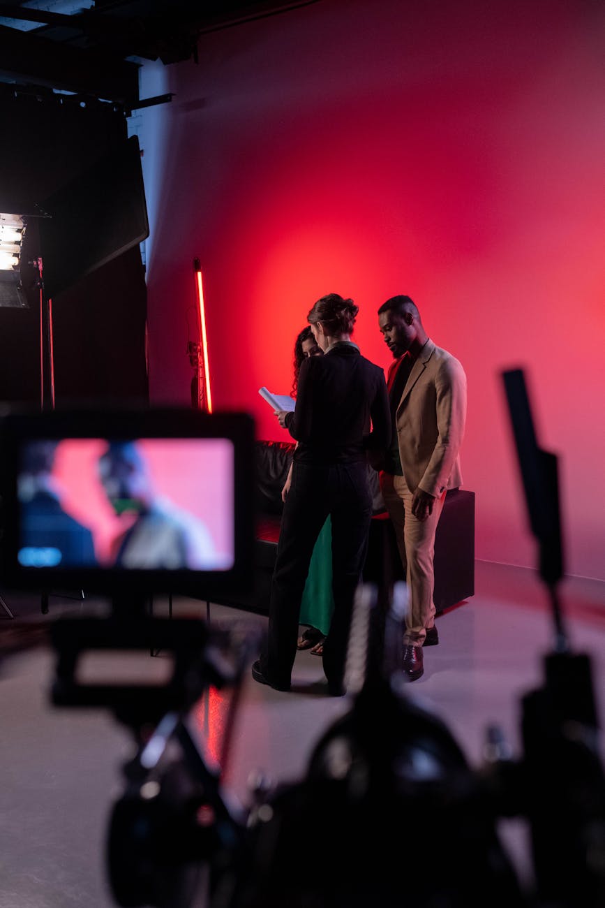 group of people standing looking at the script