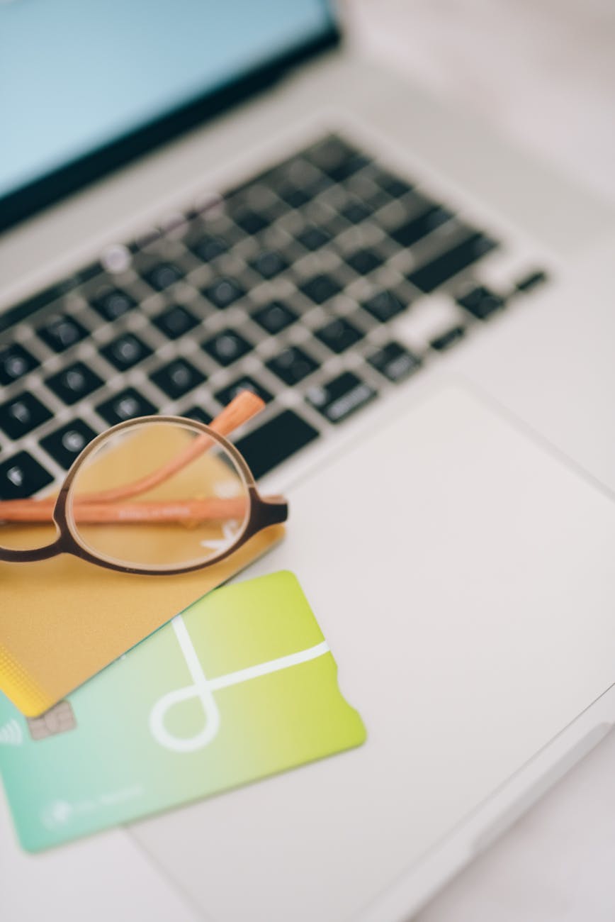 eyeglasses on top of a laptop