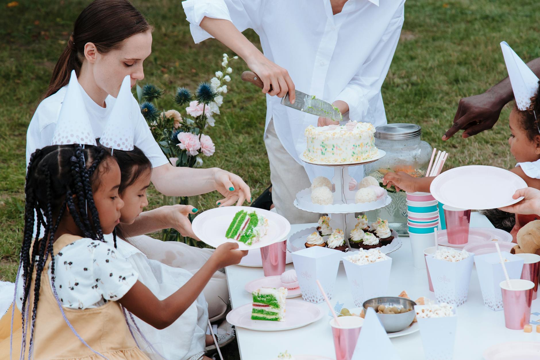 family celebrating birthday in garden