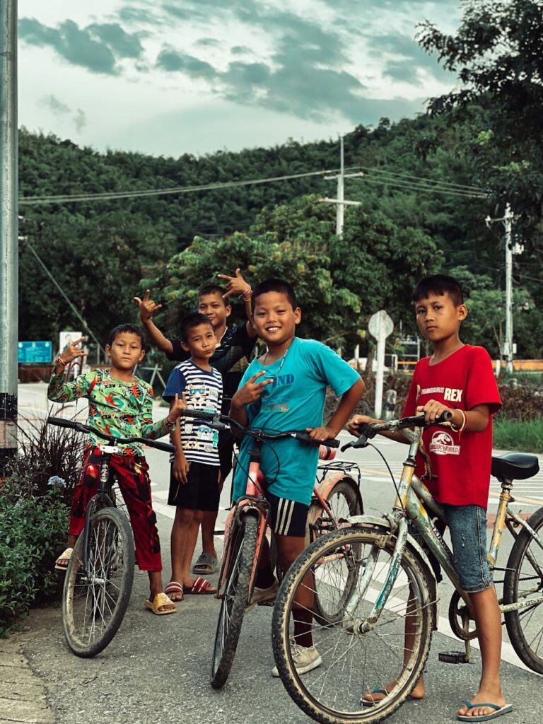 group of kids enjoying bicycle ride outdoors