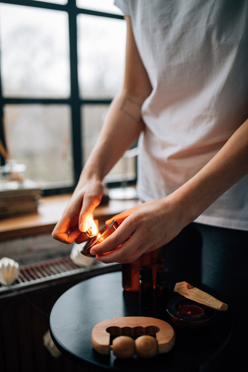 a person lighting a candle