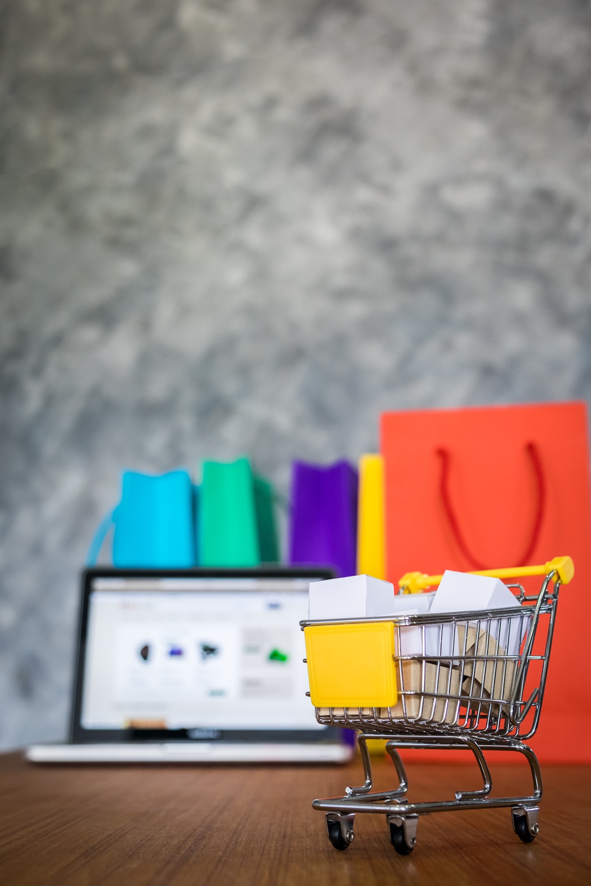 laptop and shopping bags, online shopping concept.