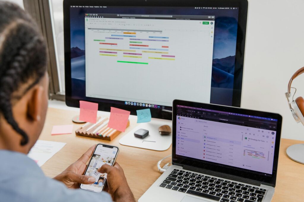 man using smartphone while working