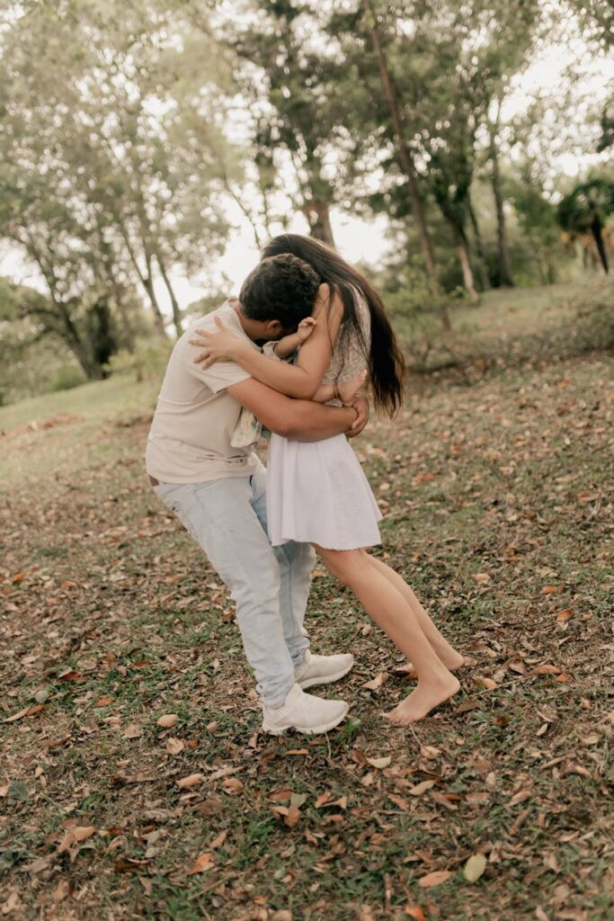 romantic couple embracing in a forest clearing