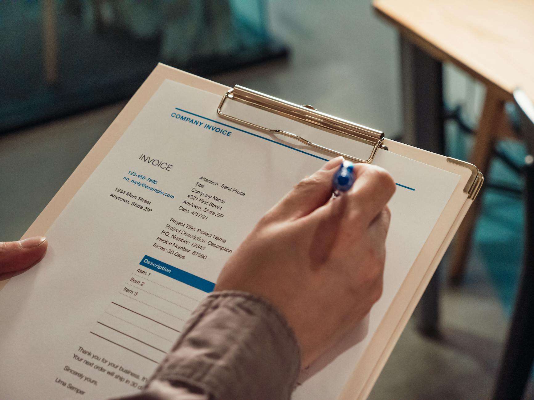 close up shot of a person holding a clipboard