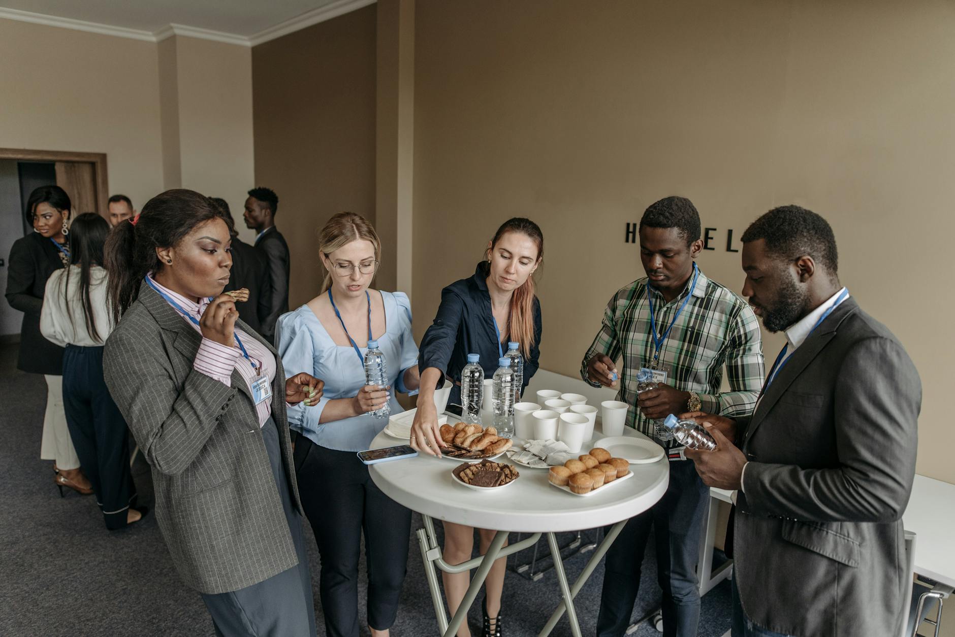 people eating while standing at the table