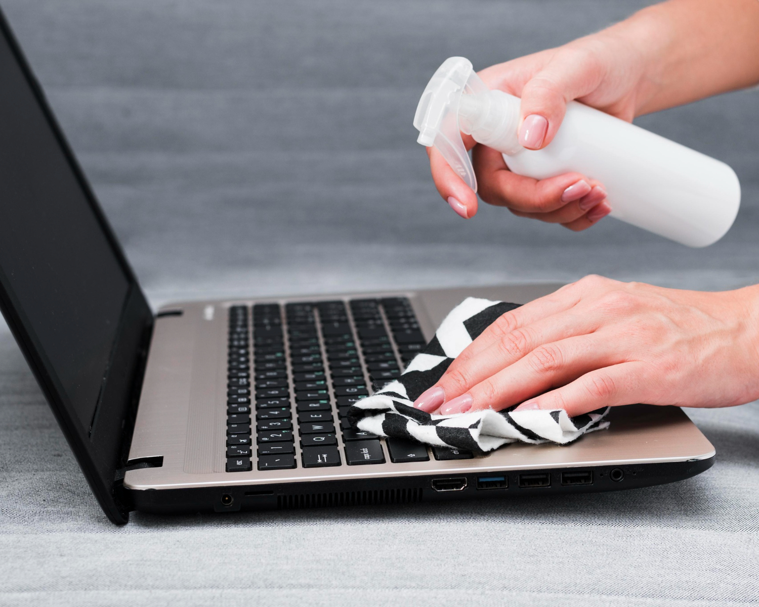 dusting a laptop