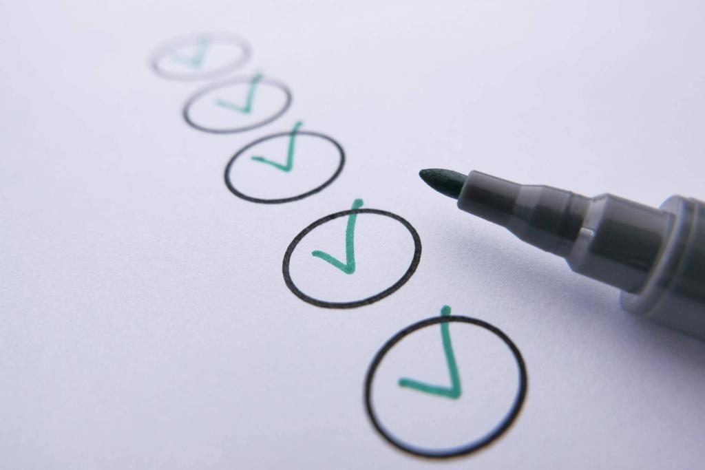 a marker near checked circles on white paper