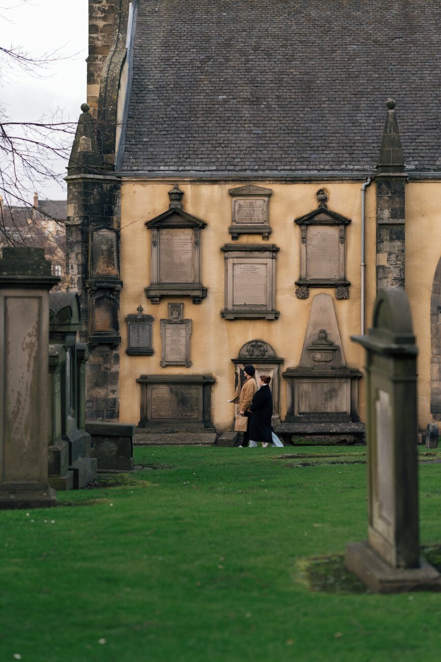 historic cemetery in edinburgh with church and gravestones