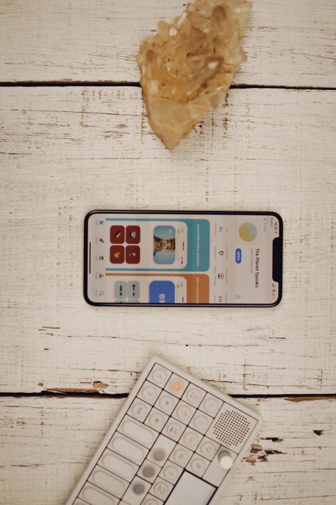 flat lay of smartphone and keyboard on rustic surface
