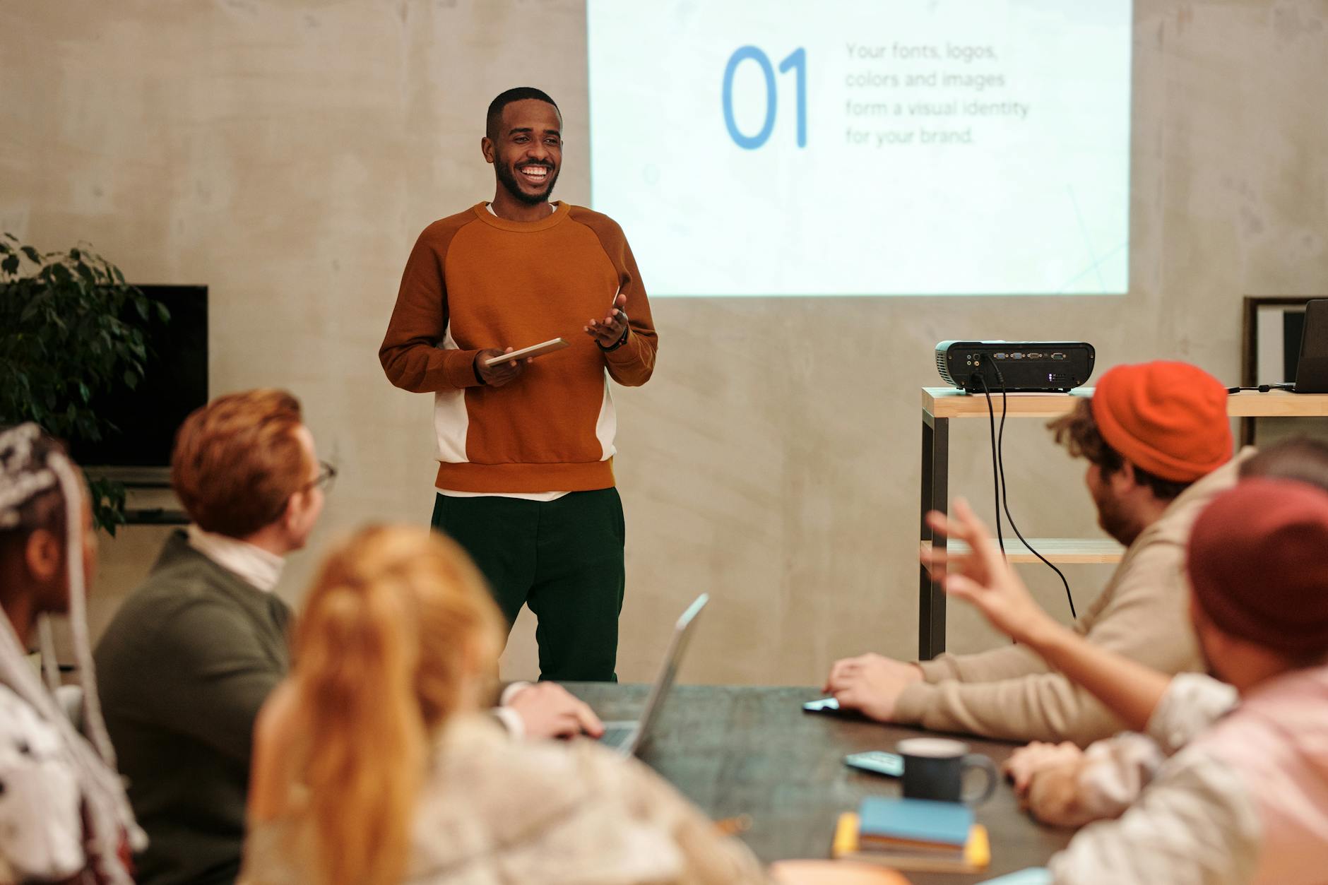 man in sweatshirt in front of people