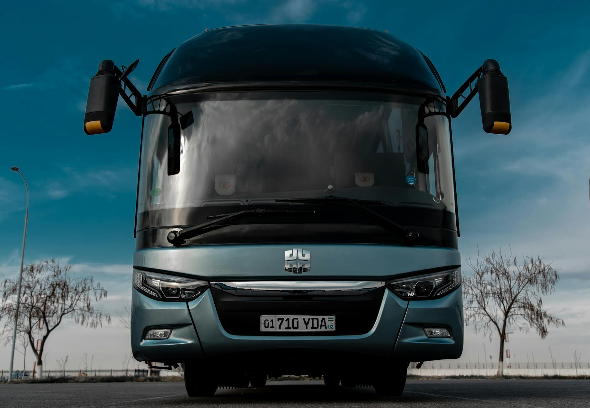 black blue bus on road