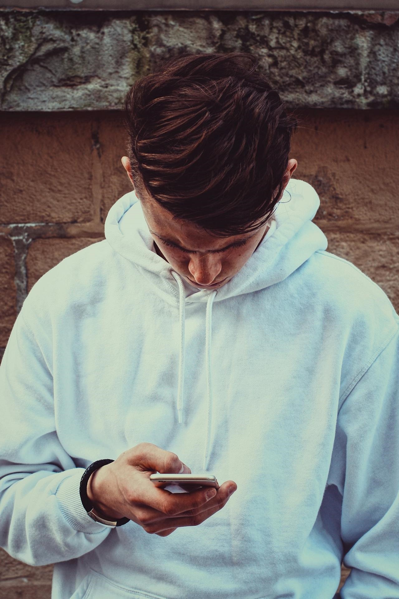 boy looking at phone