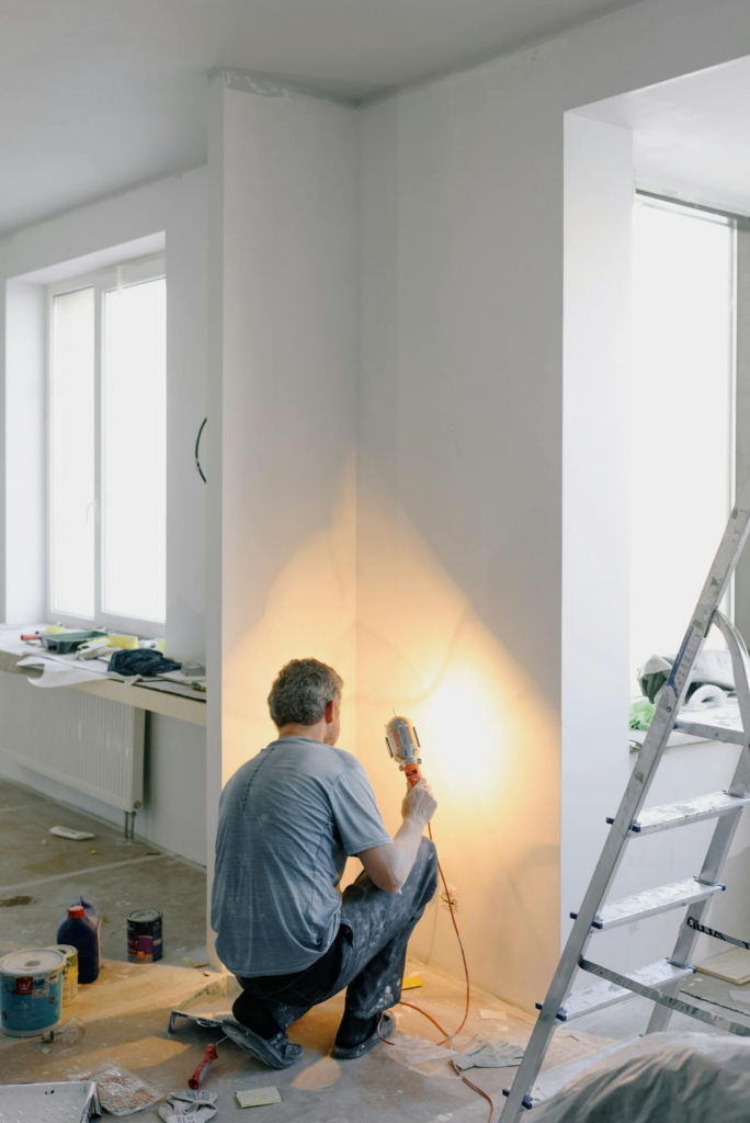 Faceless man working with lamp in room - Lead Grow Develop - Business, Technology, Personal Development Faceless man working with lamp in room