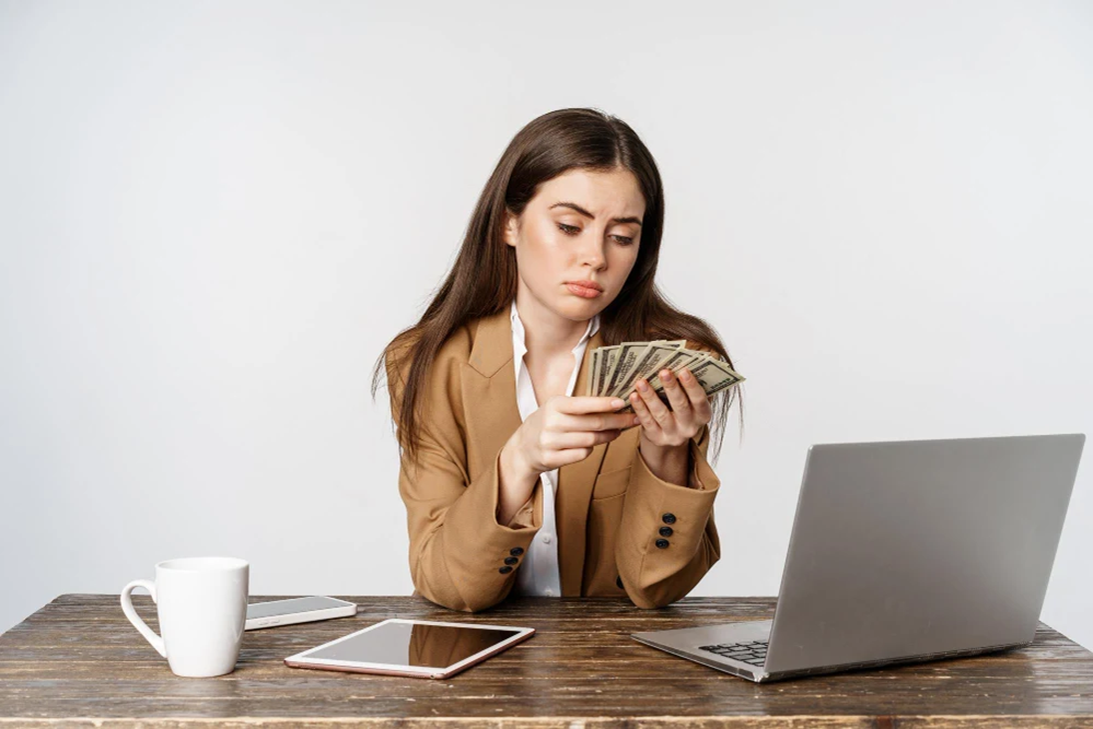 woman holding money and budgeting - Lead Grow Develop - Business, Technology, Personal Development woman holding money and budgeting